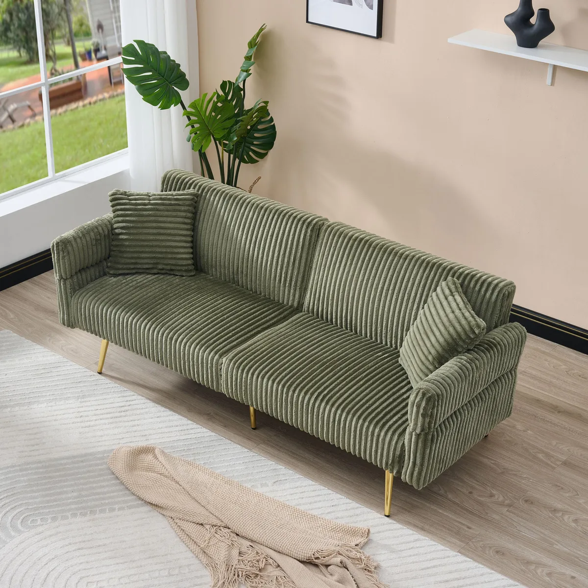 Green corduroy foldable sofa bed with adjustable armrests and two pillows