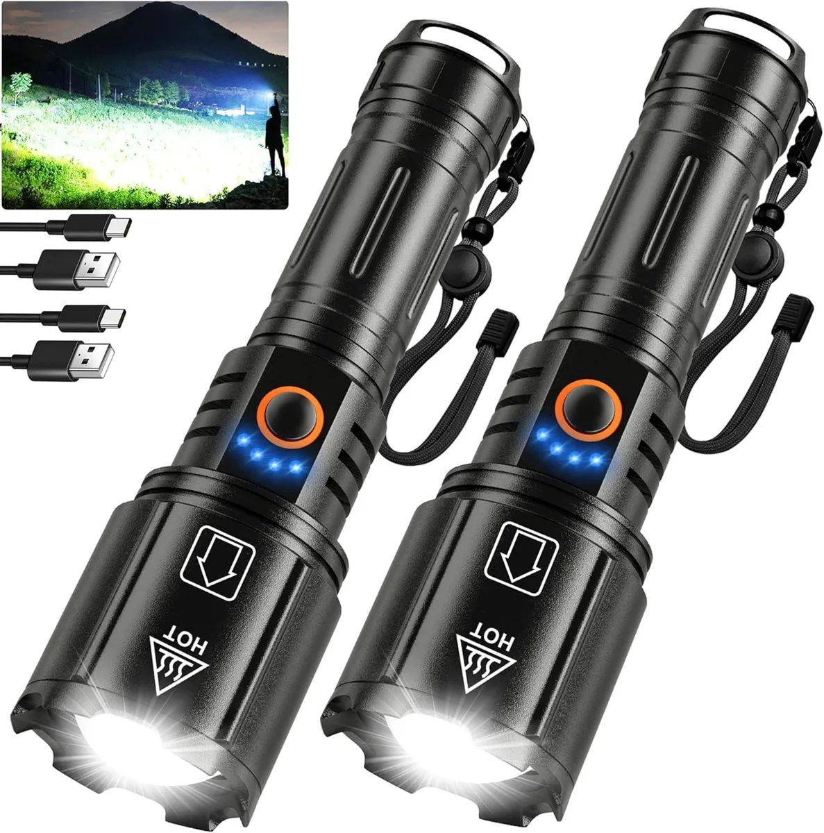 Two black cylindrical flashlights with textured grip and adjustable heads lying side by side