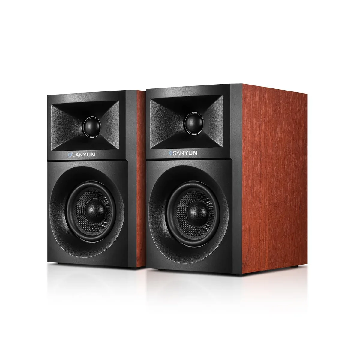 Pair of compact desktop speakers in dark finish, front-facing drivers visible