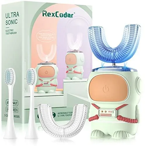 Green U-shaped electric toothbrush with cartoon astronaut body, two brush heads and USB cable