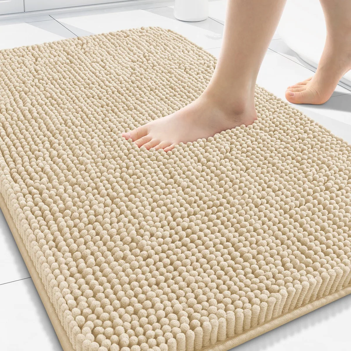 Beige rectangular chenille bath mat 30 by 20 inches