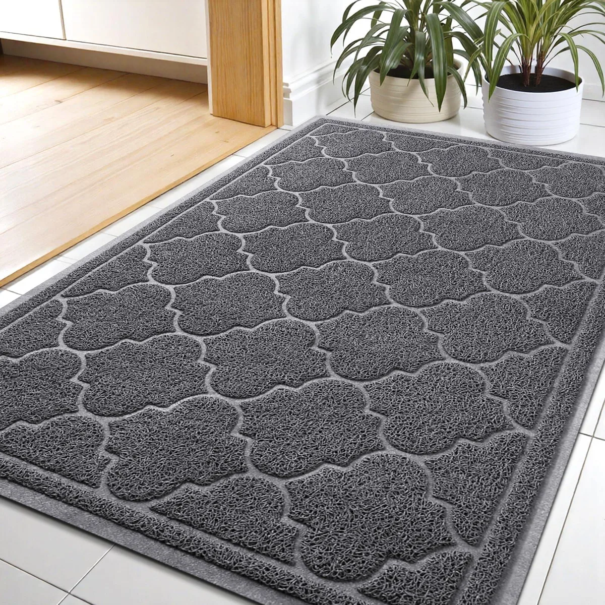 Grey rectangular door mat with striped pattern, low-profile flat design, 24 by 36 inches