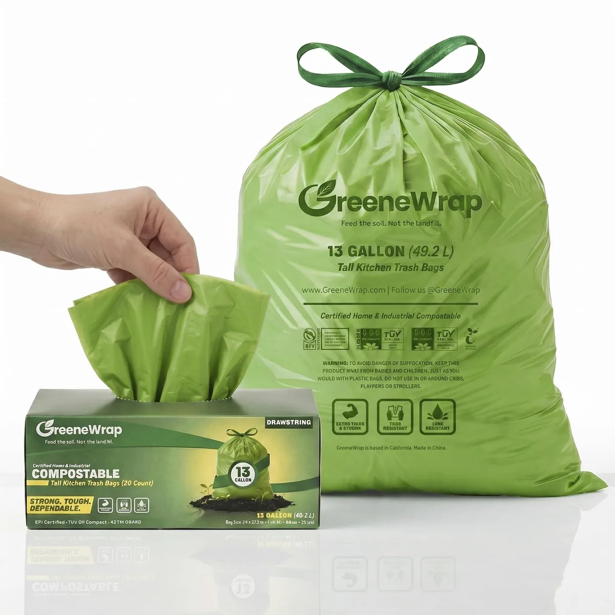 Green 13-gallon compostable trash bags with drawstring closure in box of 30