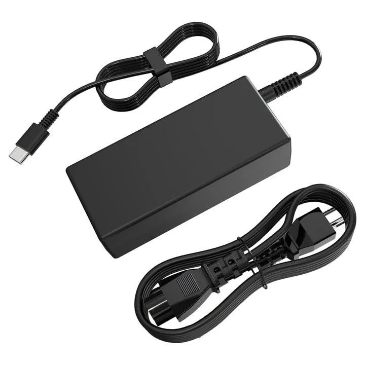Black rectangular 65W USB-C charger with long coiled cable