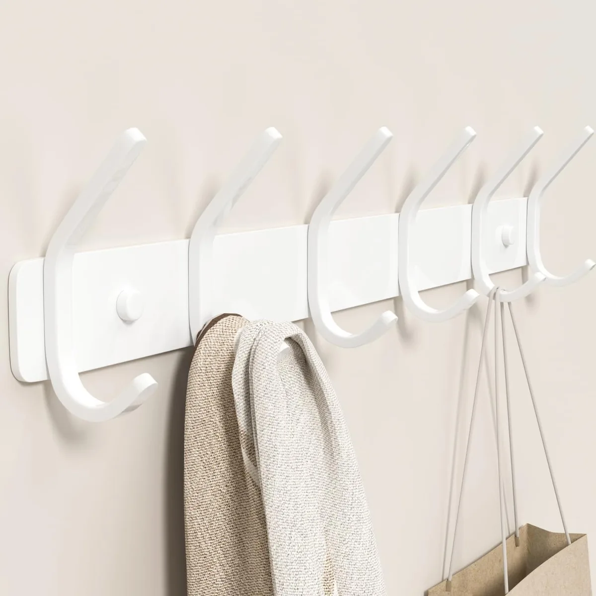 White metal wall-mounted coat rack with six double hooks, 15 inch length