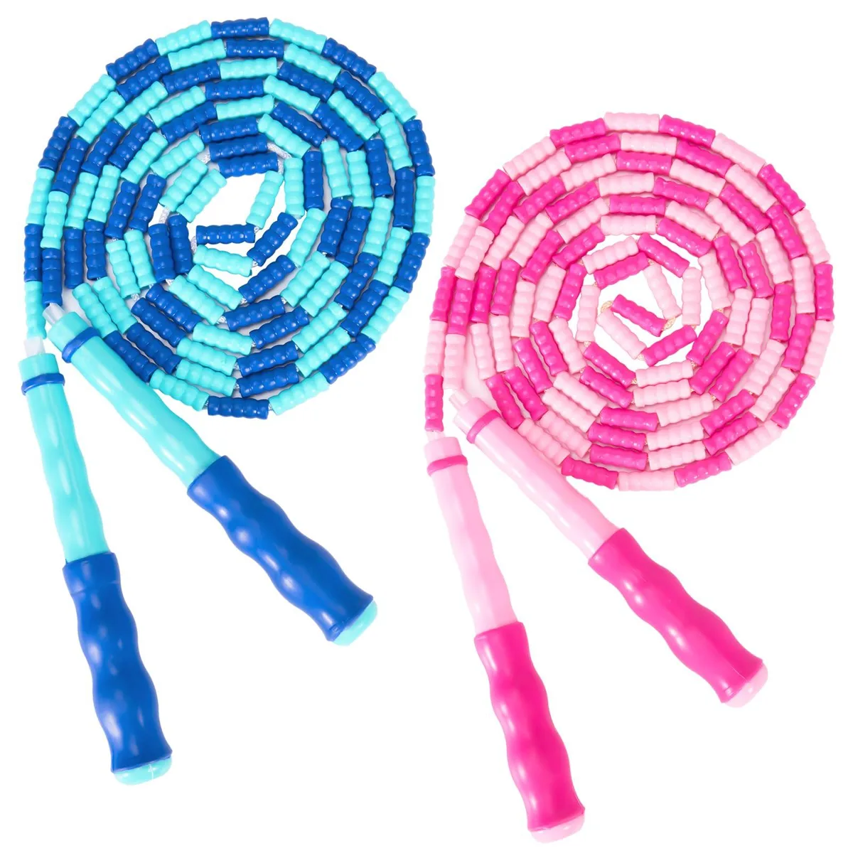 Two bright segmented jump ropes with wave-textured handles lying coiled on a light surface