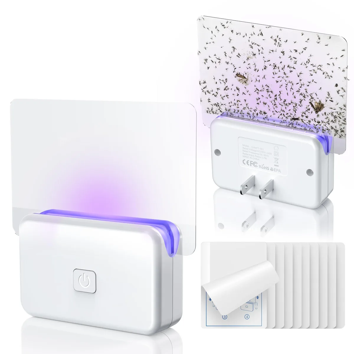 Two white cube plug-in traps with transparent sticky cards and ten refill cards
