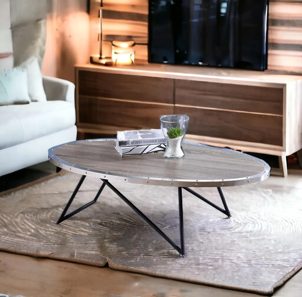 Oval coffee table with weathered gray oak top and black metal base