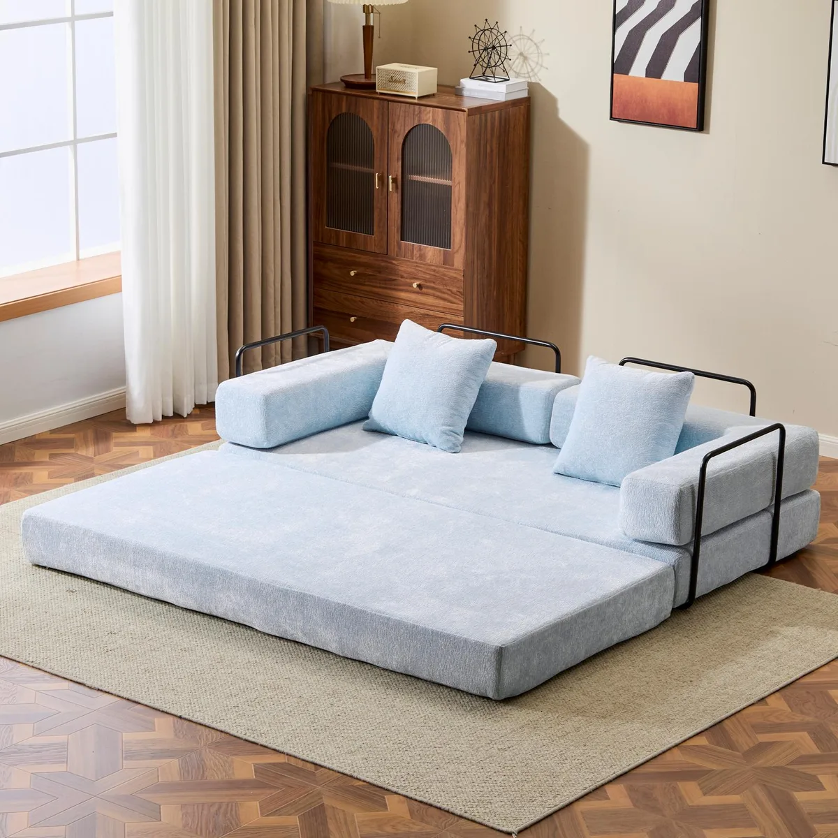 Light blue chenille convertible floor sofa bed with pillow back support and armrests