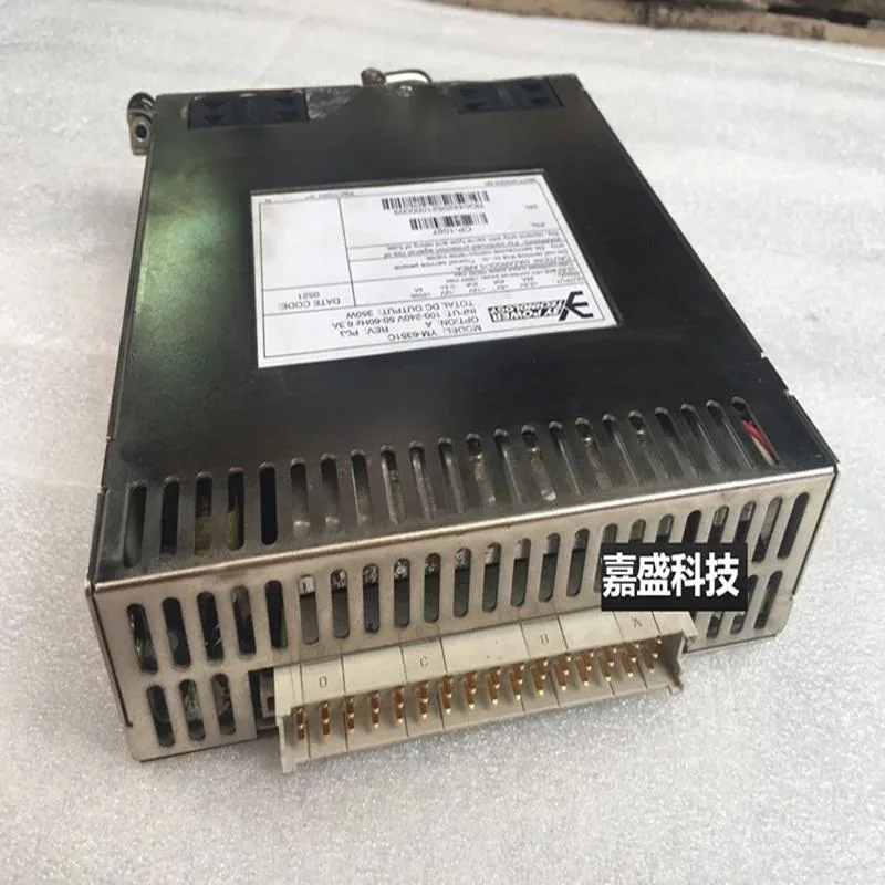 Black ATX power supply unit with cooling fan and cable bundle