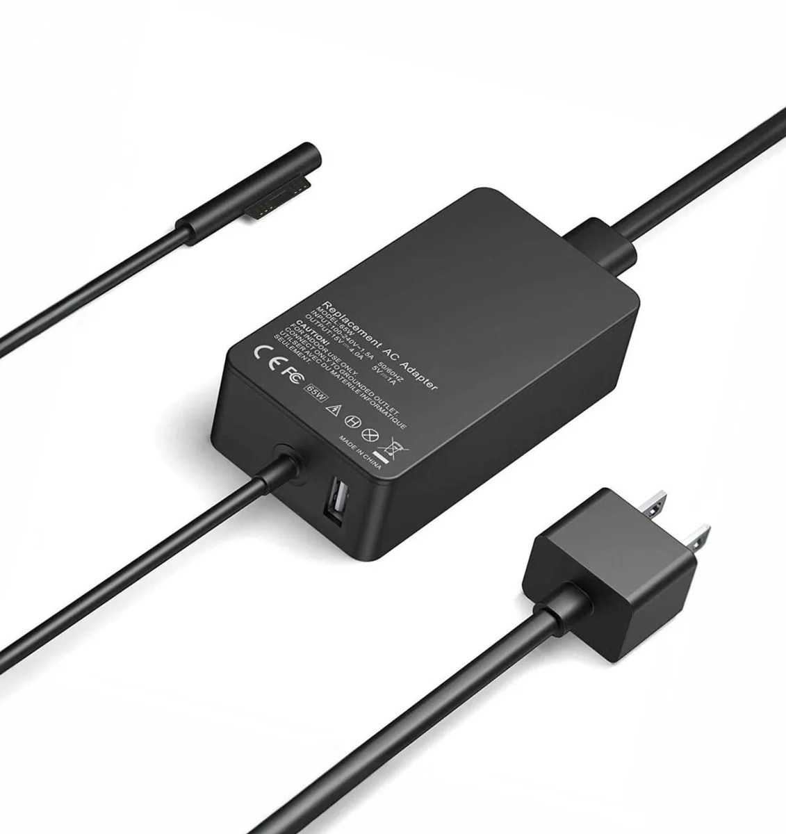 Rectangular black plastic power brick with integrated North American two-pin plug and attached cable