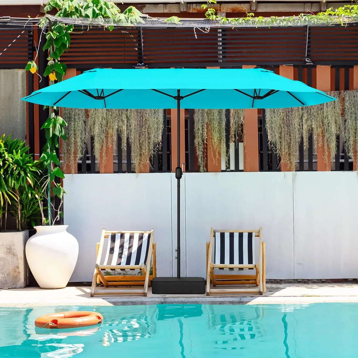 Large turquoise double-sided patio umbrella with crank handle and cross base