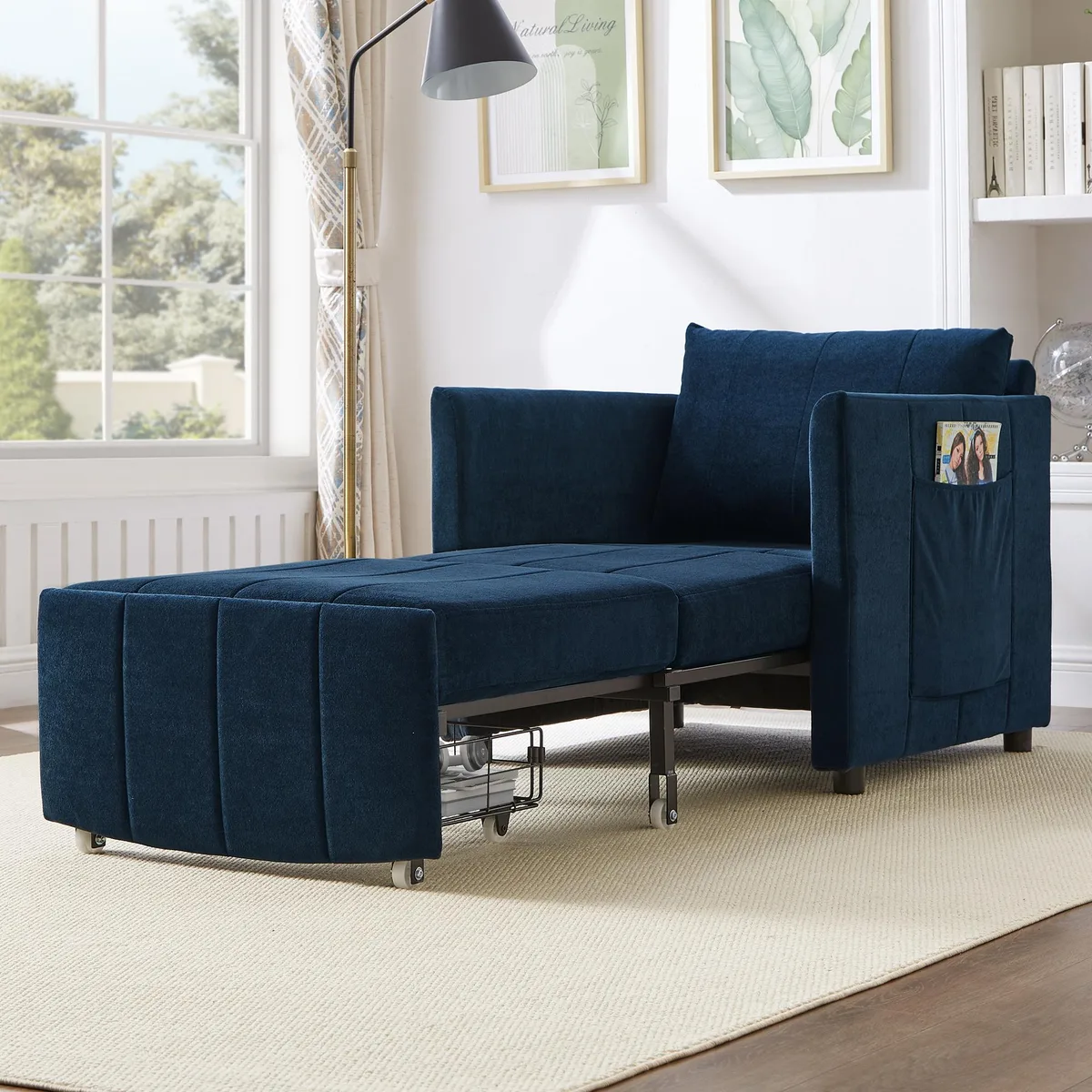 Blue chenille convertible sleeper sofa folded into chair form with side pockets