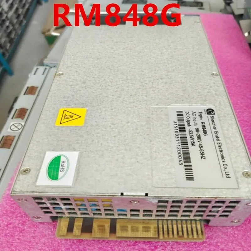 Rectangular silver ATX power supply unit with fan grille and side label