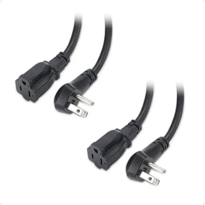 Two black low-profile right-angle power extension cords with flat plugs and moulded strain relief