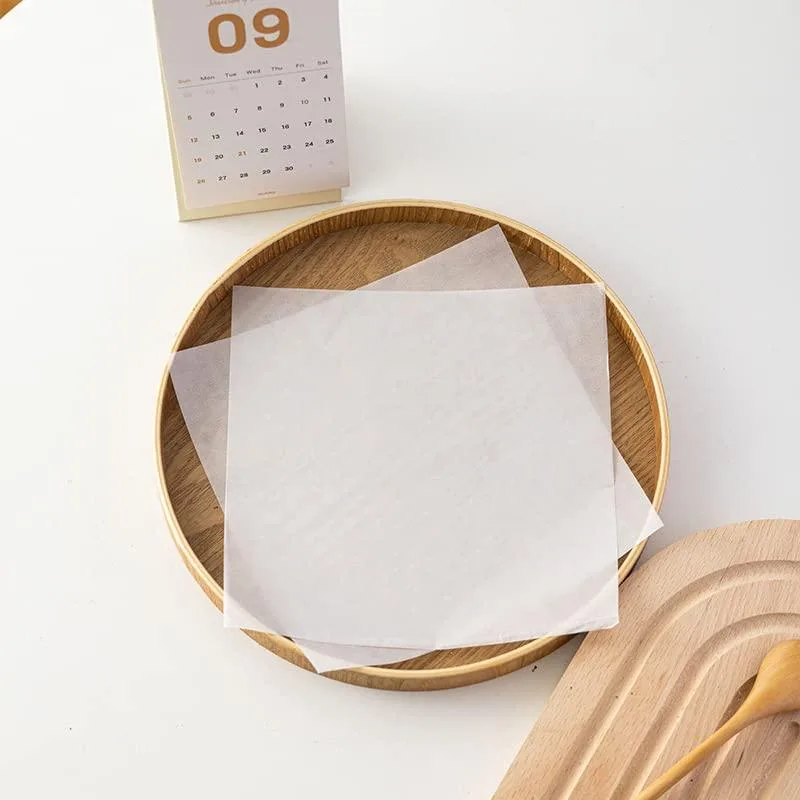 Stack of 100 pure white 7x7 inch wax paper sheets