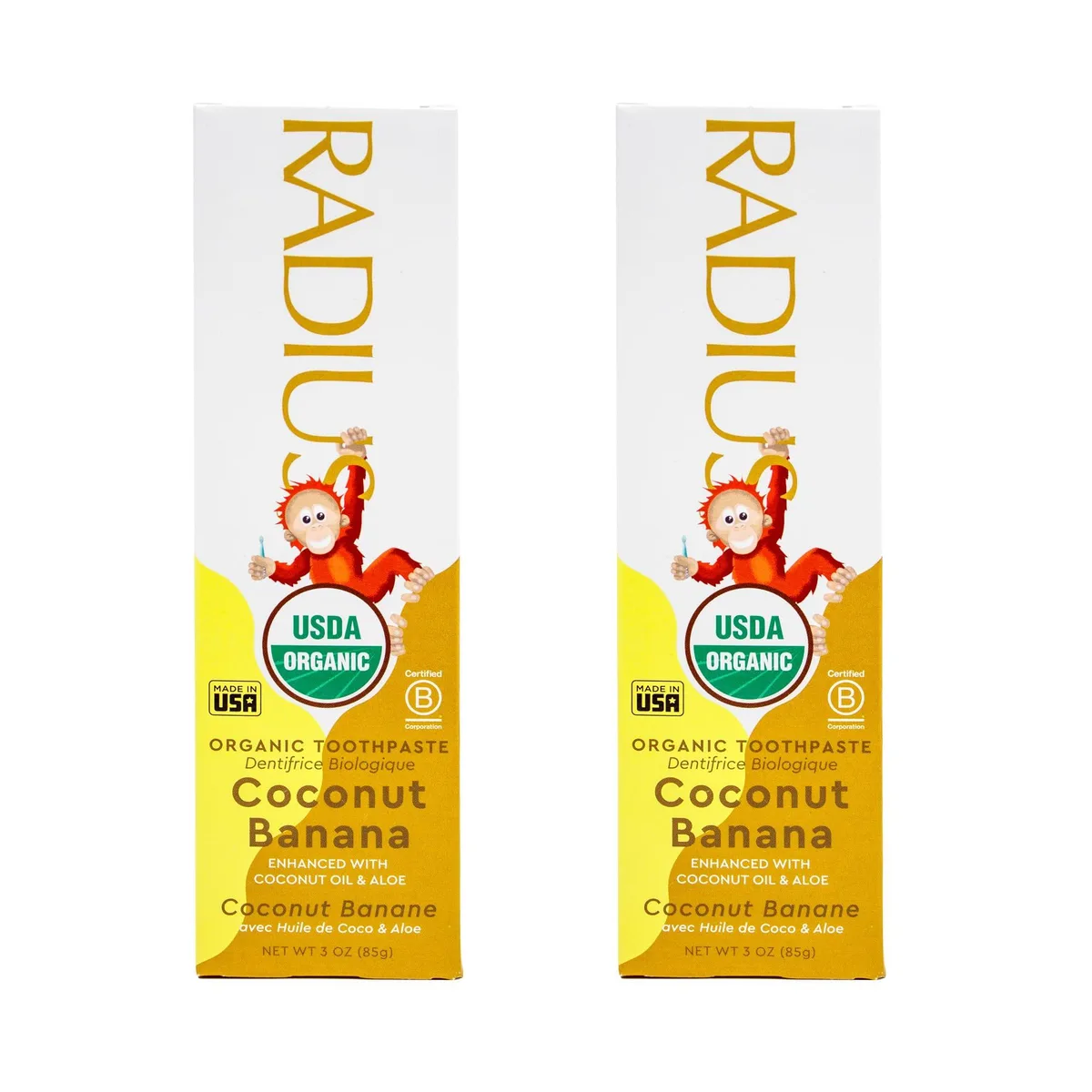 Two white tubes with green caps and coconut banana labels