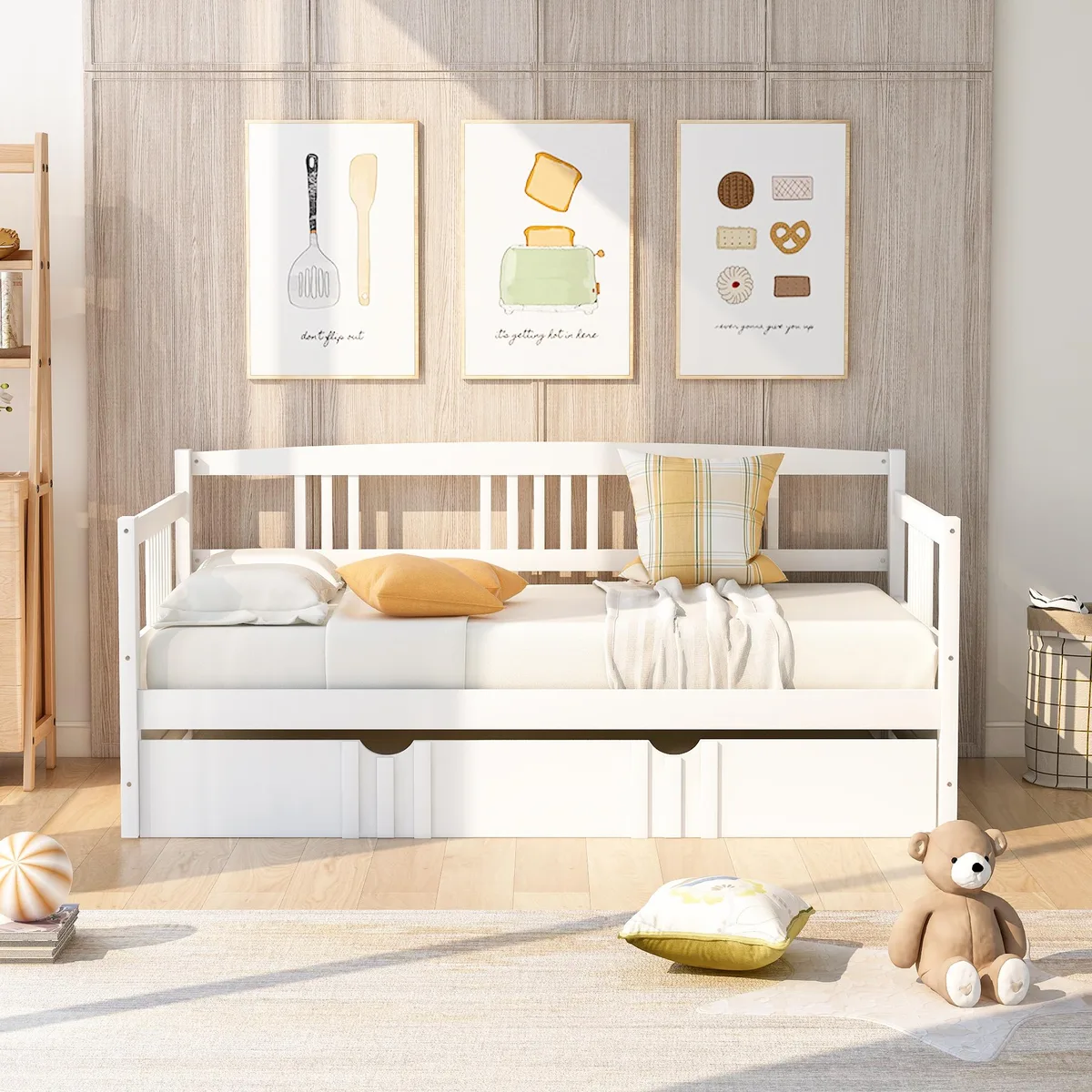 White wooden twin daybed with pull-out trundle, three-sided rails, slatted bases