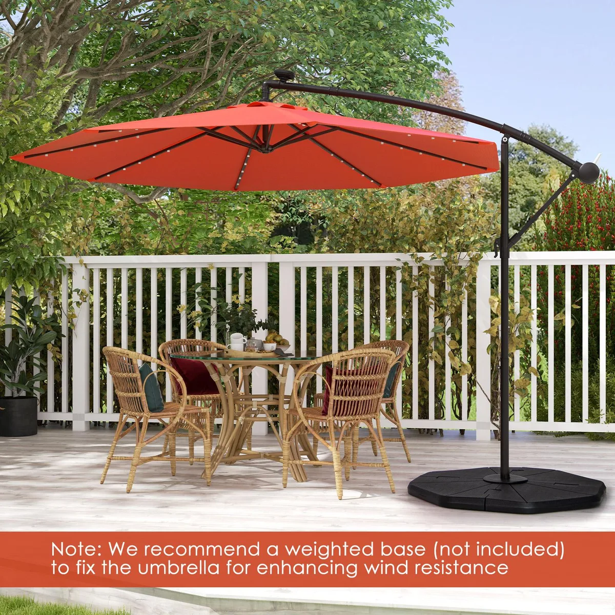 Orange 10-foot offset patio umbrella with solar panel and cross base