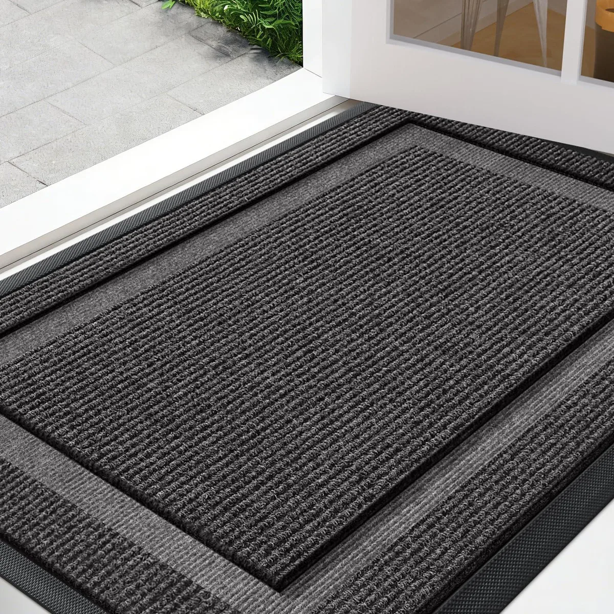 Grey 32 by 20 inch door mat with striped bamboo surface and rubber backing
