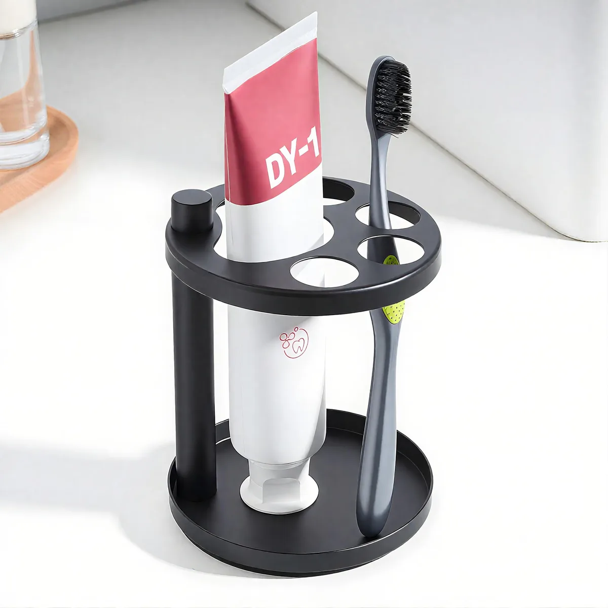 Black stainless steel toothbrush holder with ventilated slots and weighted base
