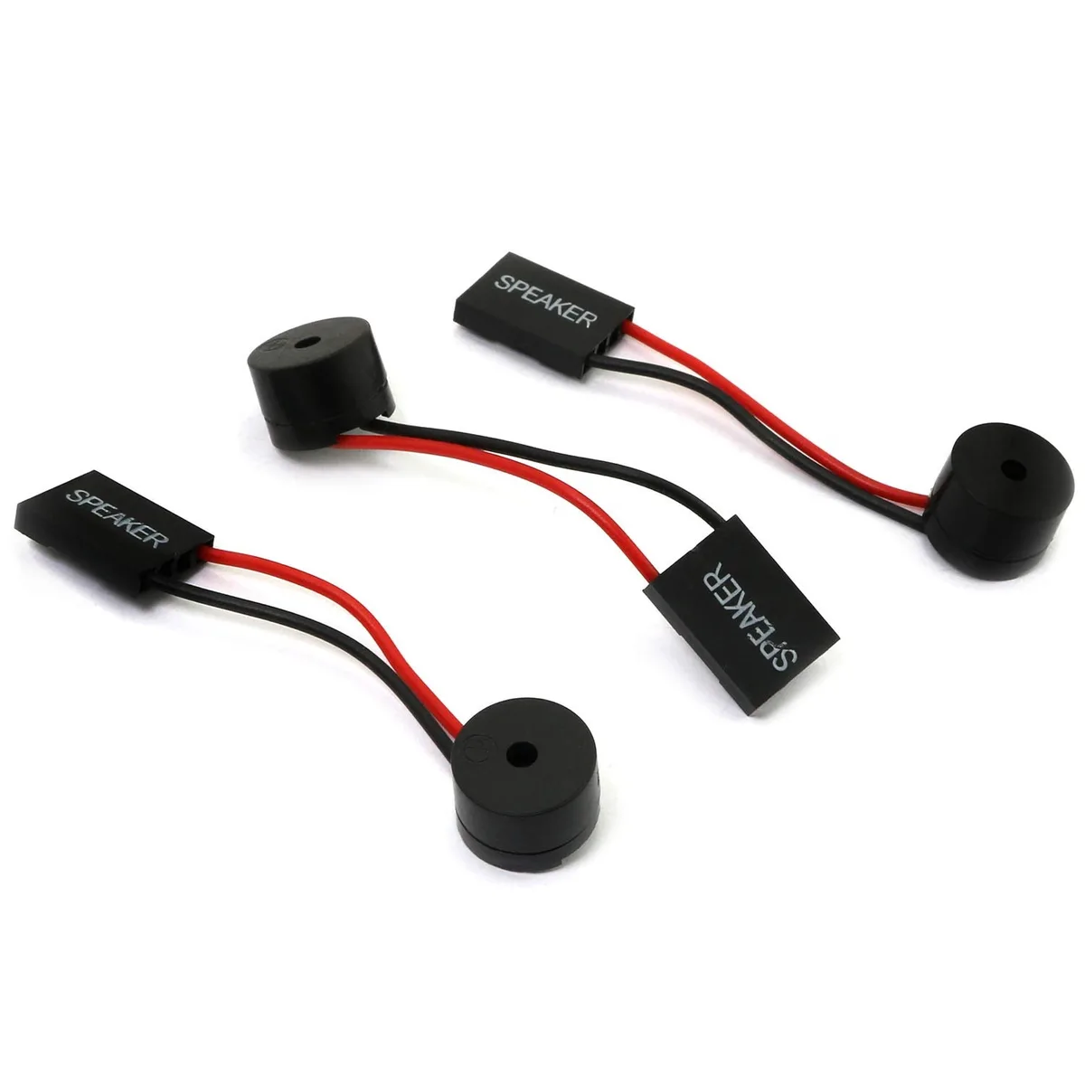 Three small black cylindrical speakers with red and black wires and white connectors on a plain background