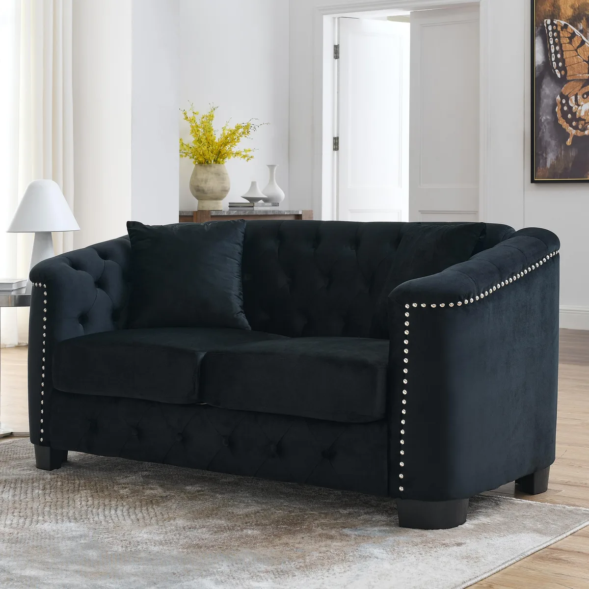 Black 59-inch Chesterfield velvet sofa with tufted backrest, nailhead trim arms and two cushions