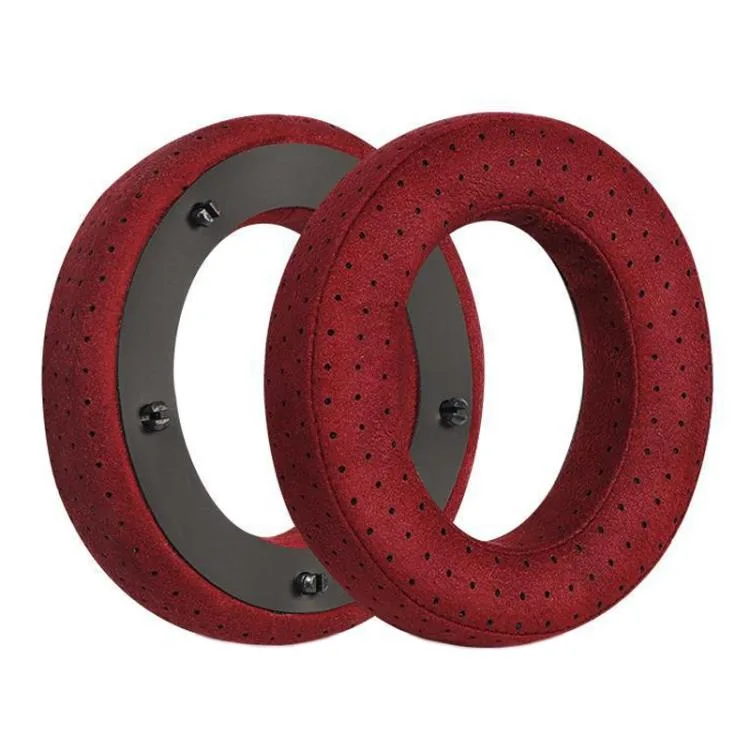 Pair of red fiber-textured headphone earpad covers with buckle fastening, shown flat