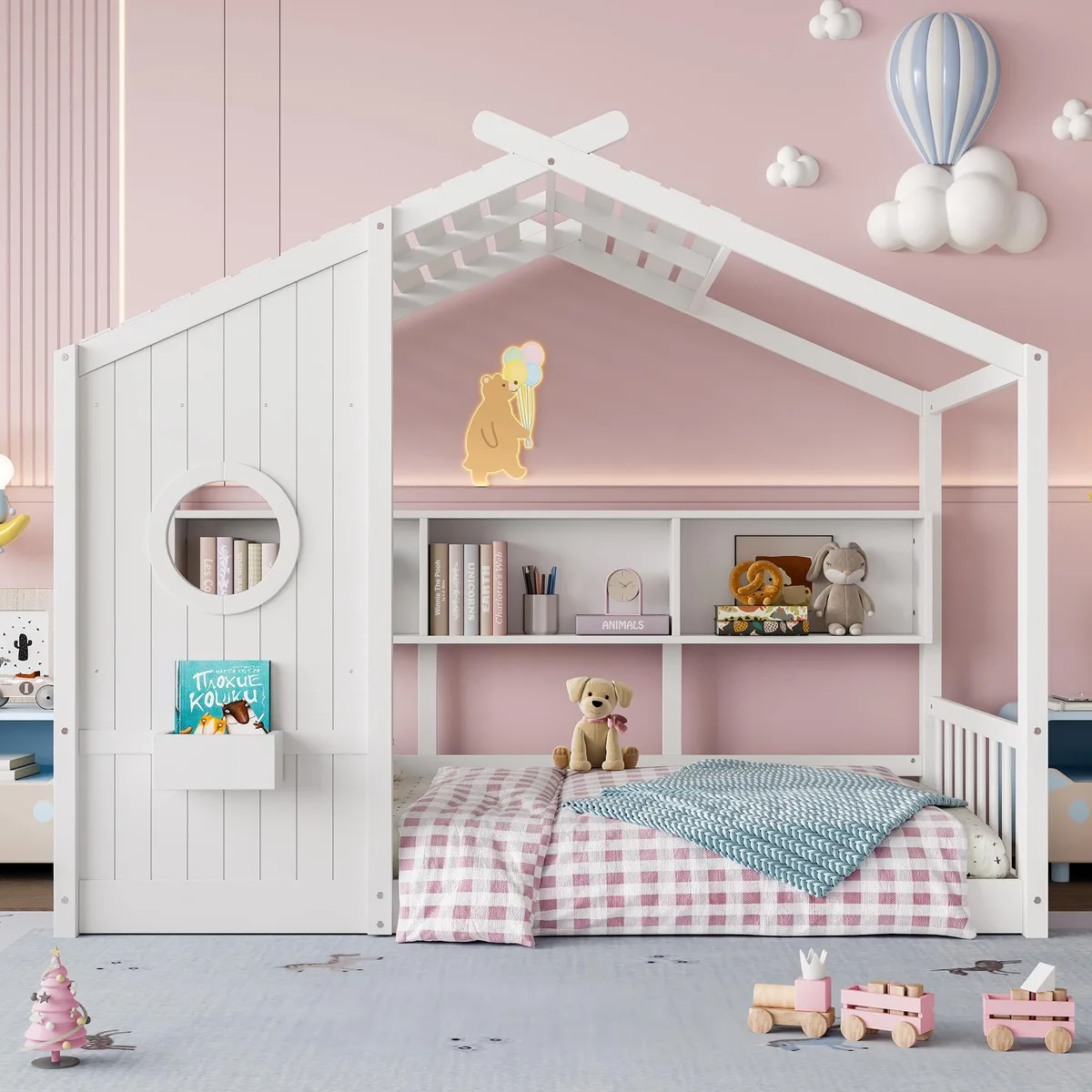 White wooden twin floor bed with house-shaped roof frame and side storage shelf