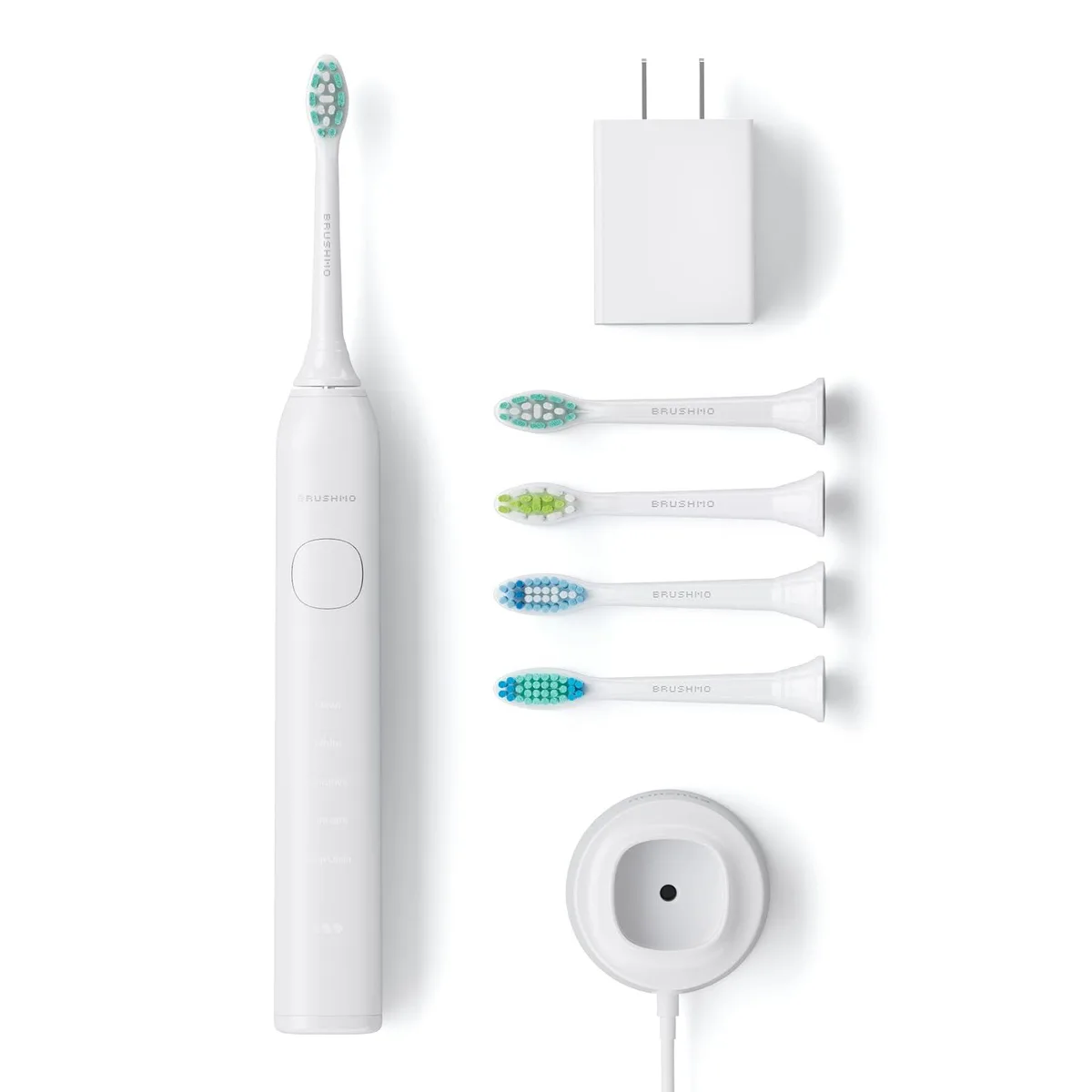 White electric toothbrush handle with four click-on brush heads and USB-C charger