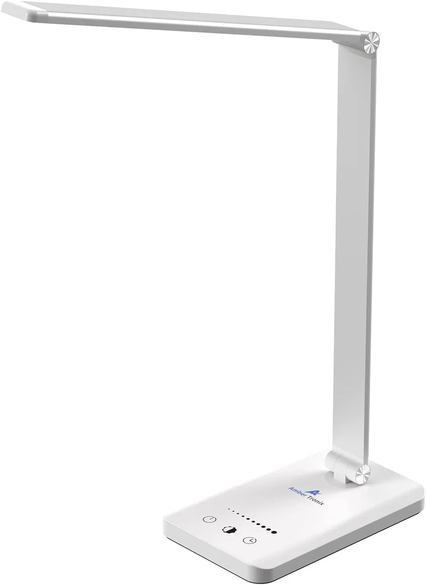 White painted desk lamp with bulb shaped head and USB charging port on base