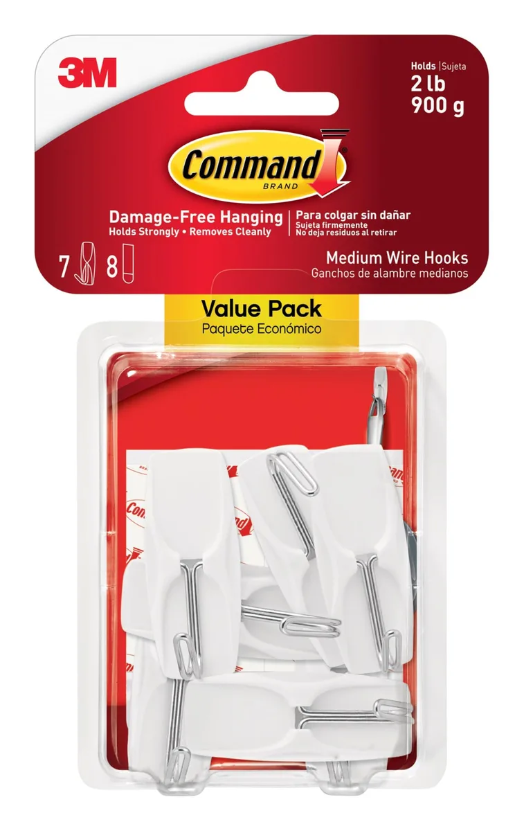 White medium wire toggle hooks with adhesive strips on backing card