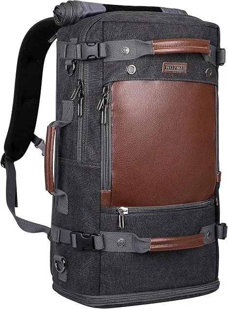 Black canvas backpack with leather trim, convertible straps, shoe compartment, fits 16 inch laptop