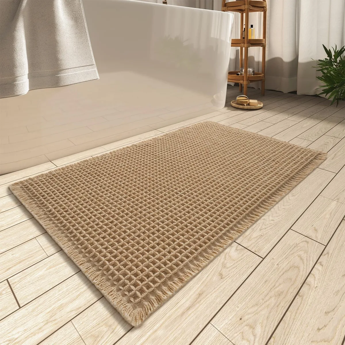 White rectangular bath mat with textured waffle pattern and rubber backing