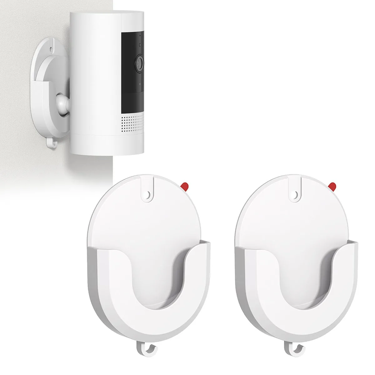 Two white adhesive camera brackets, flat rectangular shape with curved edges, smooth matte finish