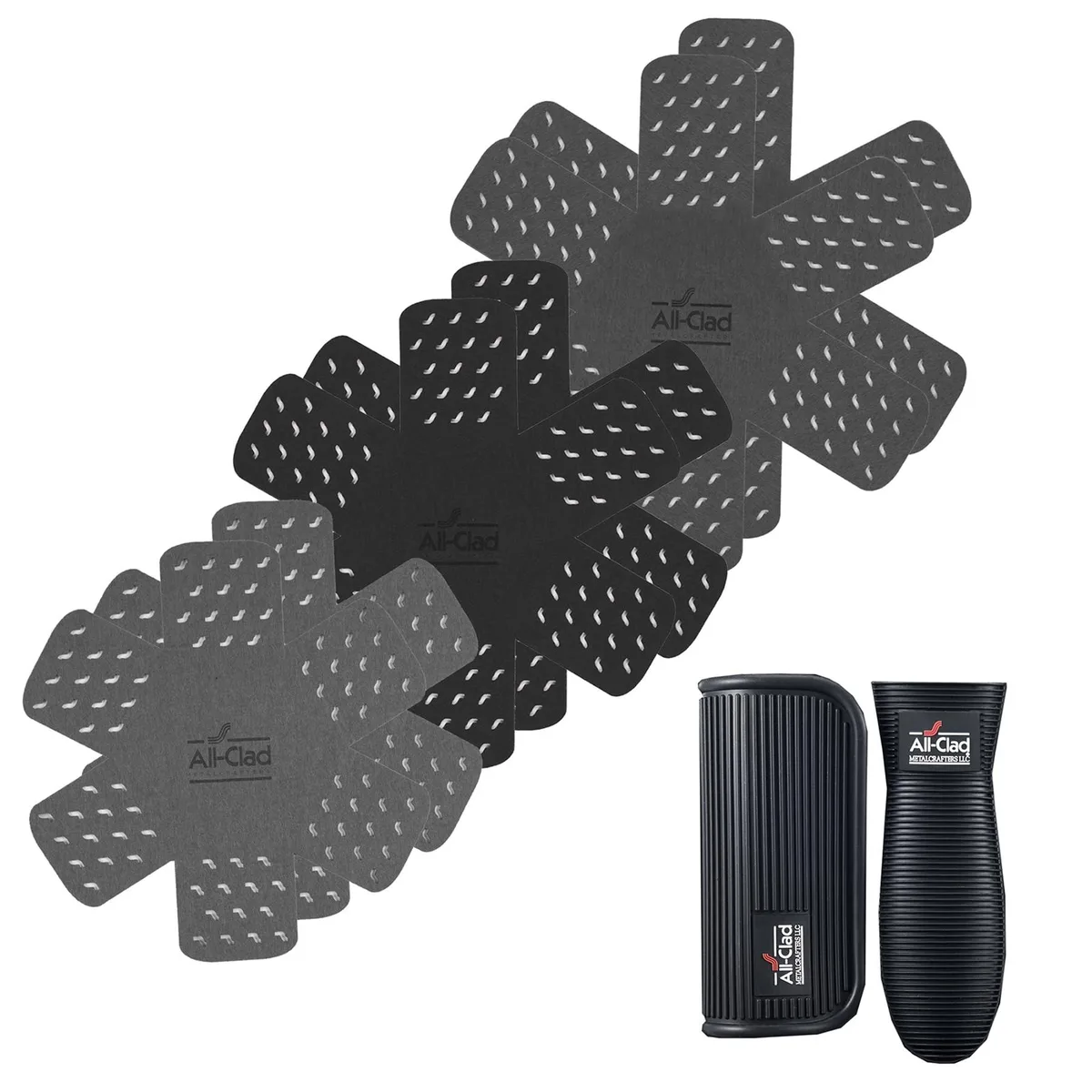 Three star-shaped fabric protectors and five silicone grips on a surface