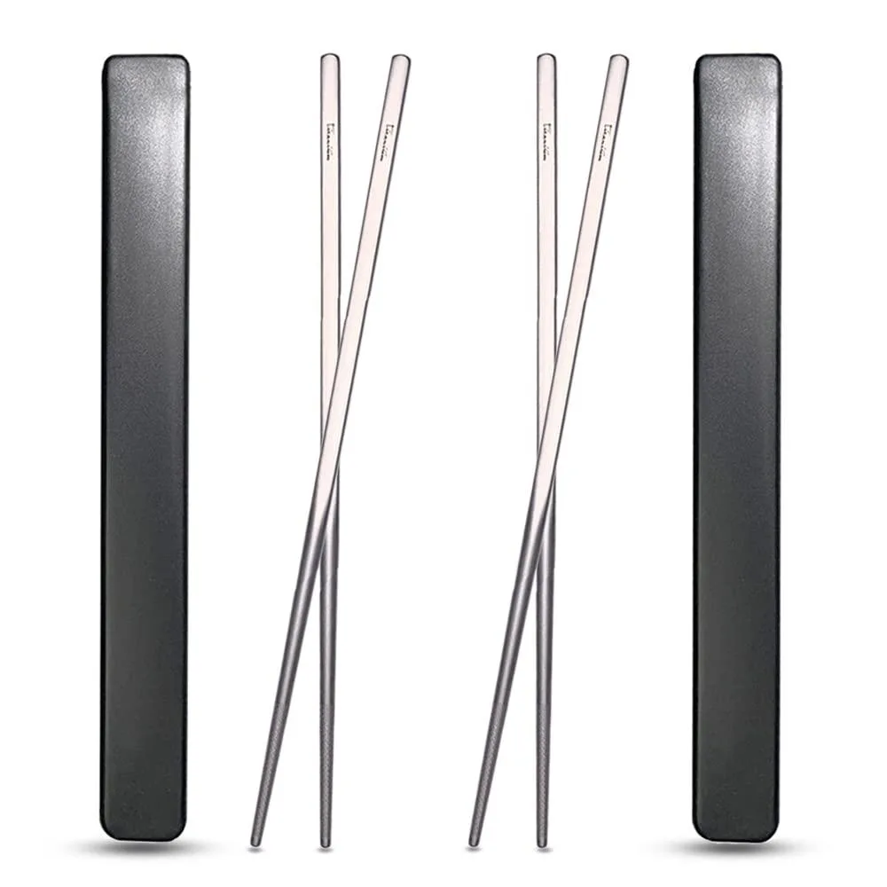 Two pairs of square black titanium chopsticks in a travel case