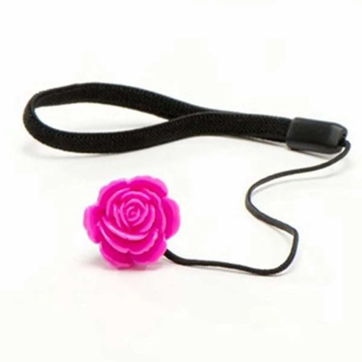 Hot pink flower-shaped disc with elastic band attached to lens cap