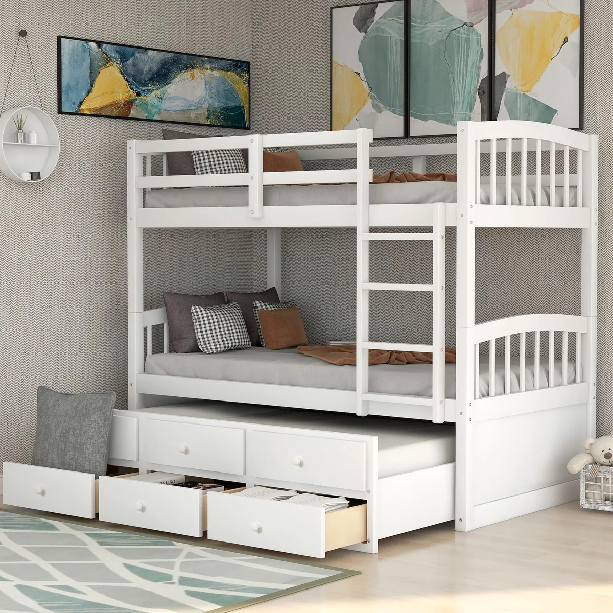 White solid-wood twin bunk bed with ladder safety rail pull-out trundle and three storage drawers