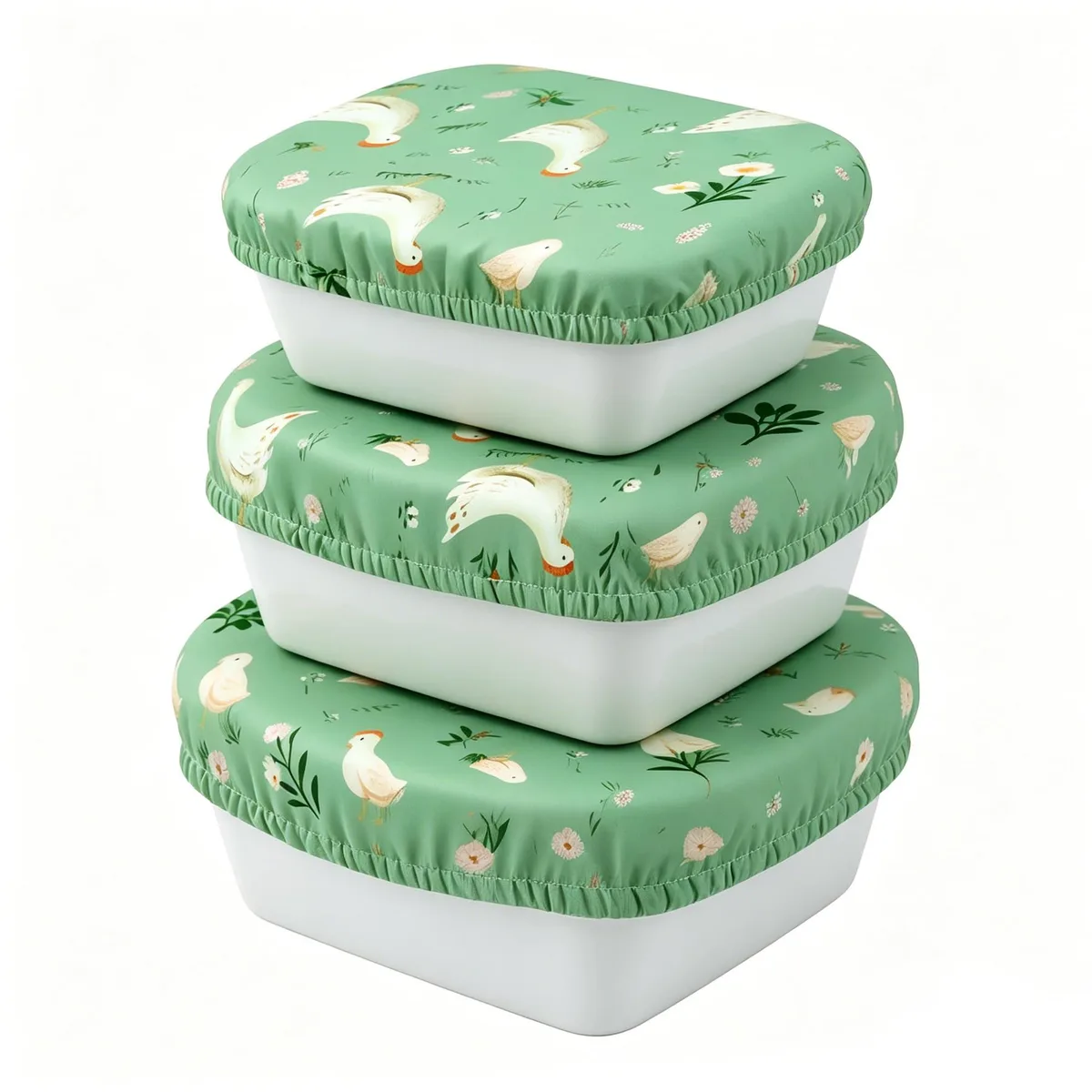 Three reusable elastic cotton bowl covers with chicken print, flat stacked showing square shape and fabric texture