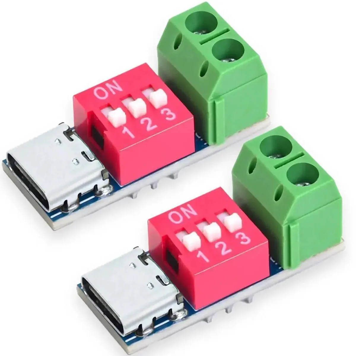 Four small green circuit boards with USB-C connectors and voltage selection pins