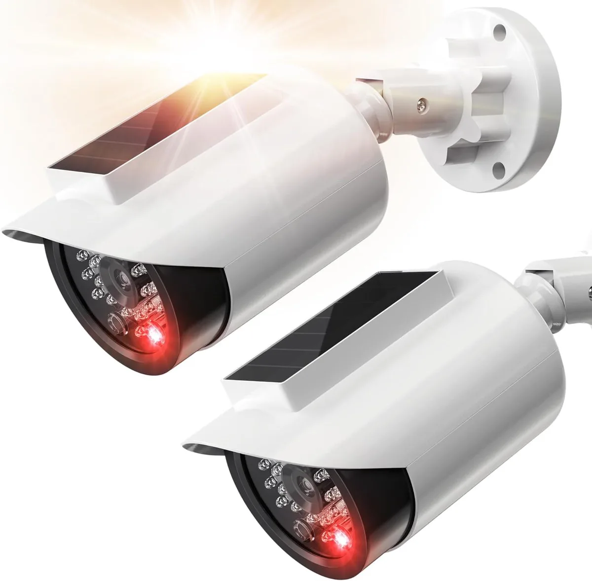 Two white bullet dummy cameras with solar panels and red LEDs, plus warning stickers