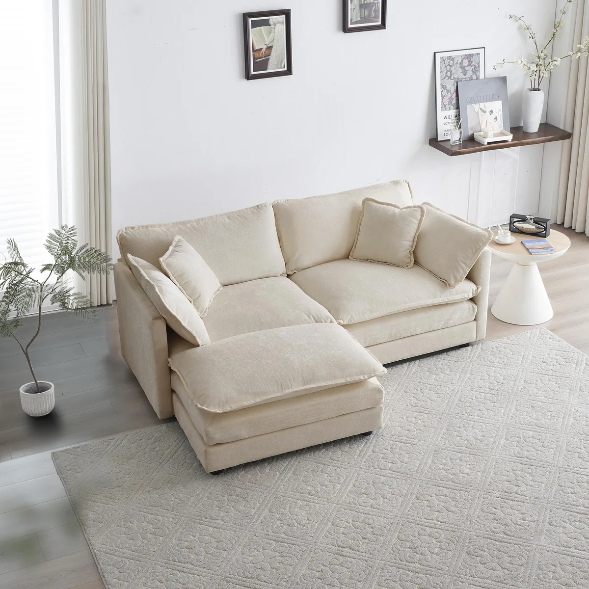 Beige chenille two-seater sofa with matching ottoman and five scatter cushions