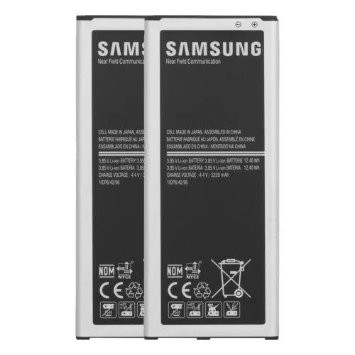 Two white Samsung wall chargers with micro USB cables