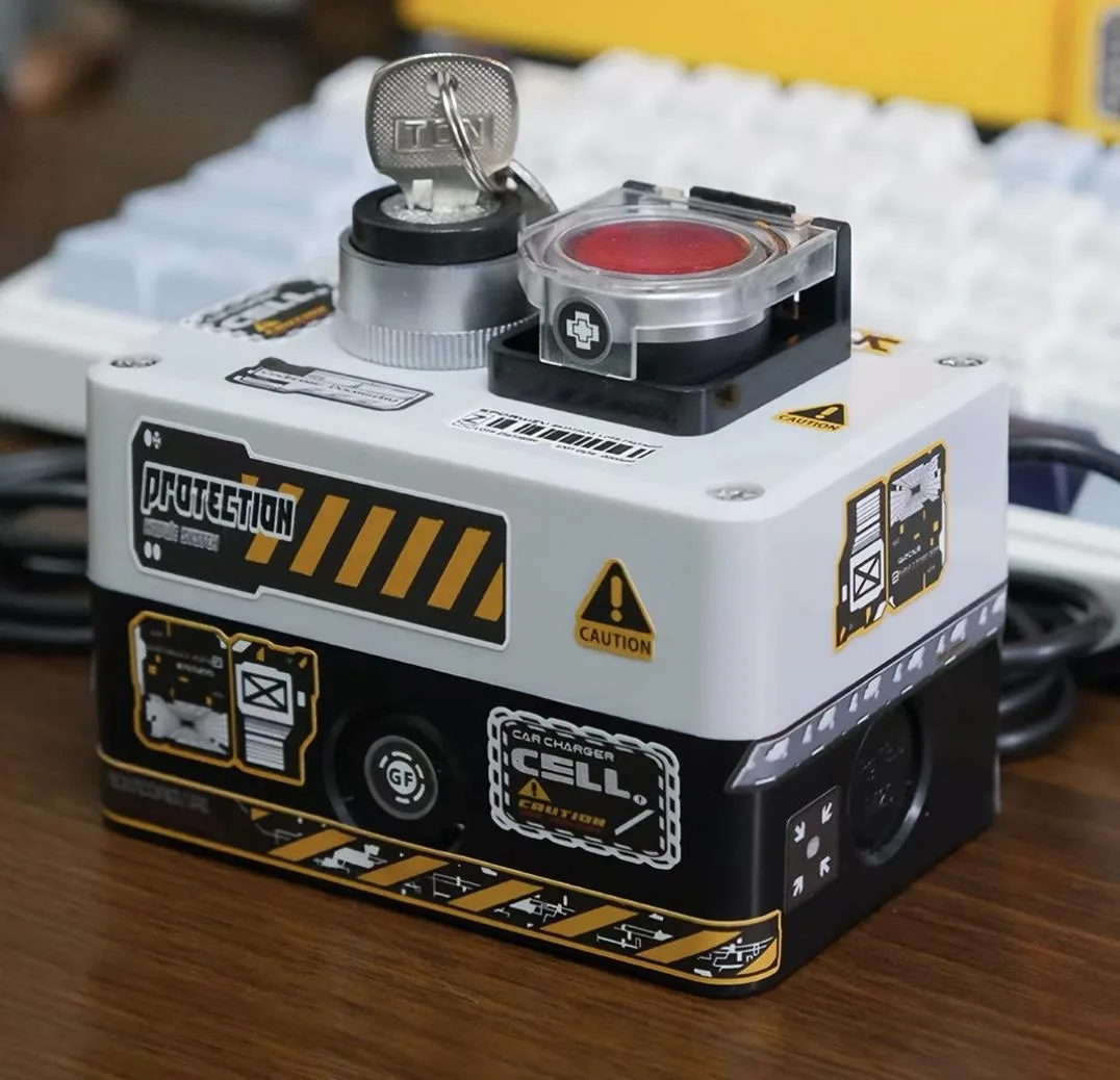 White rectangular desktop power button with large red launch-style switch and key lock, 2 m cable