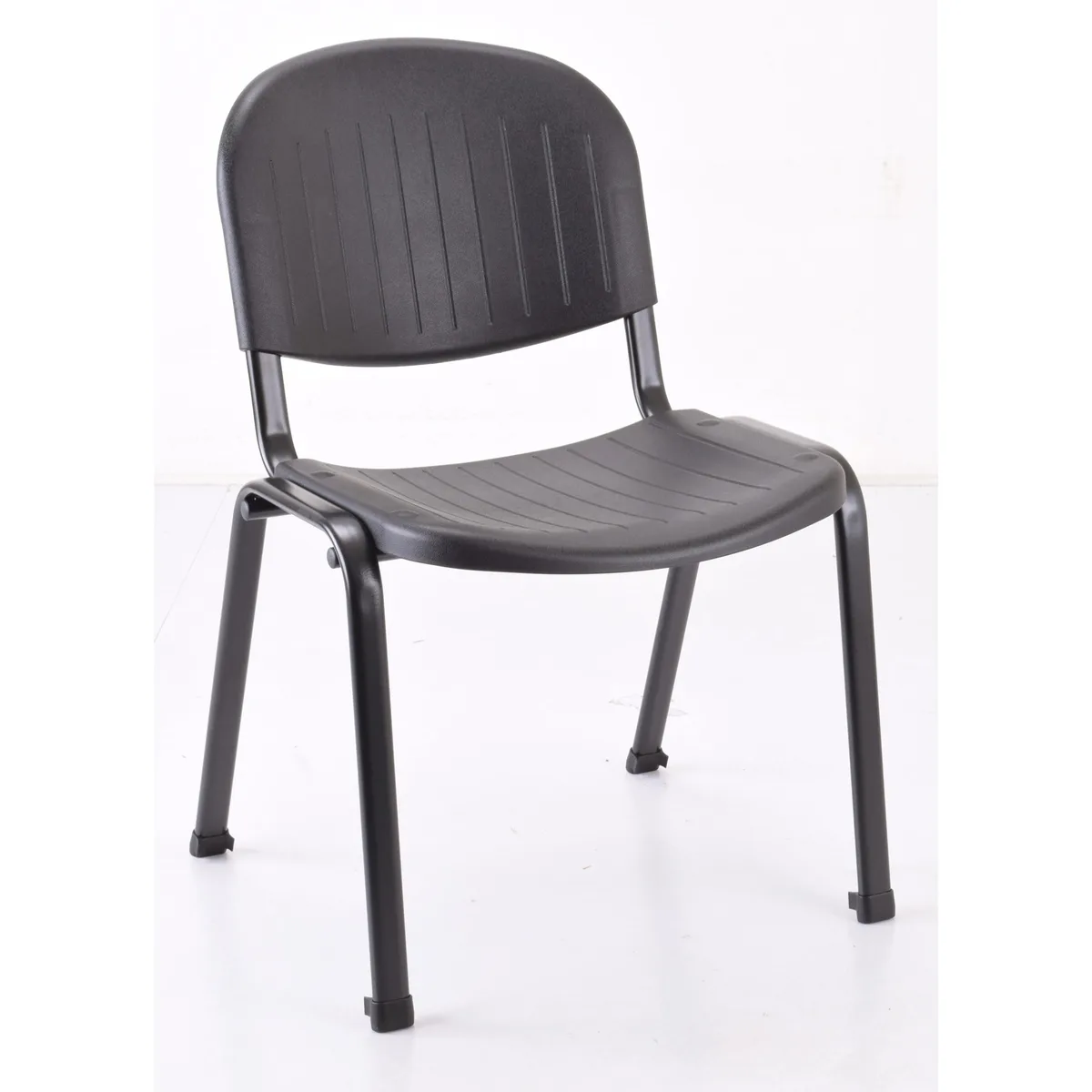 Four black polypropylene stacking chairs with silver metal legs and protective feet