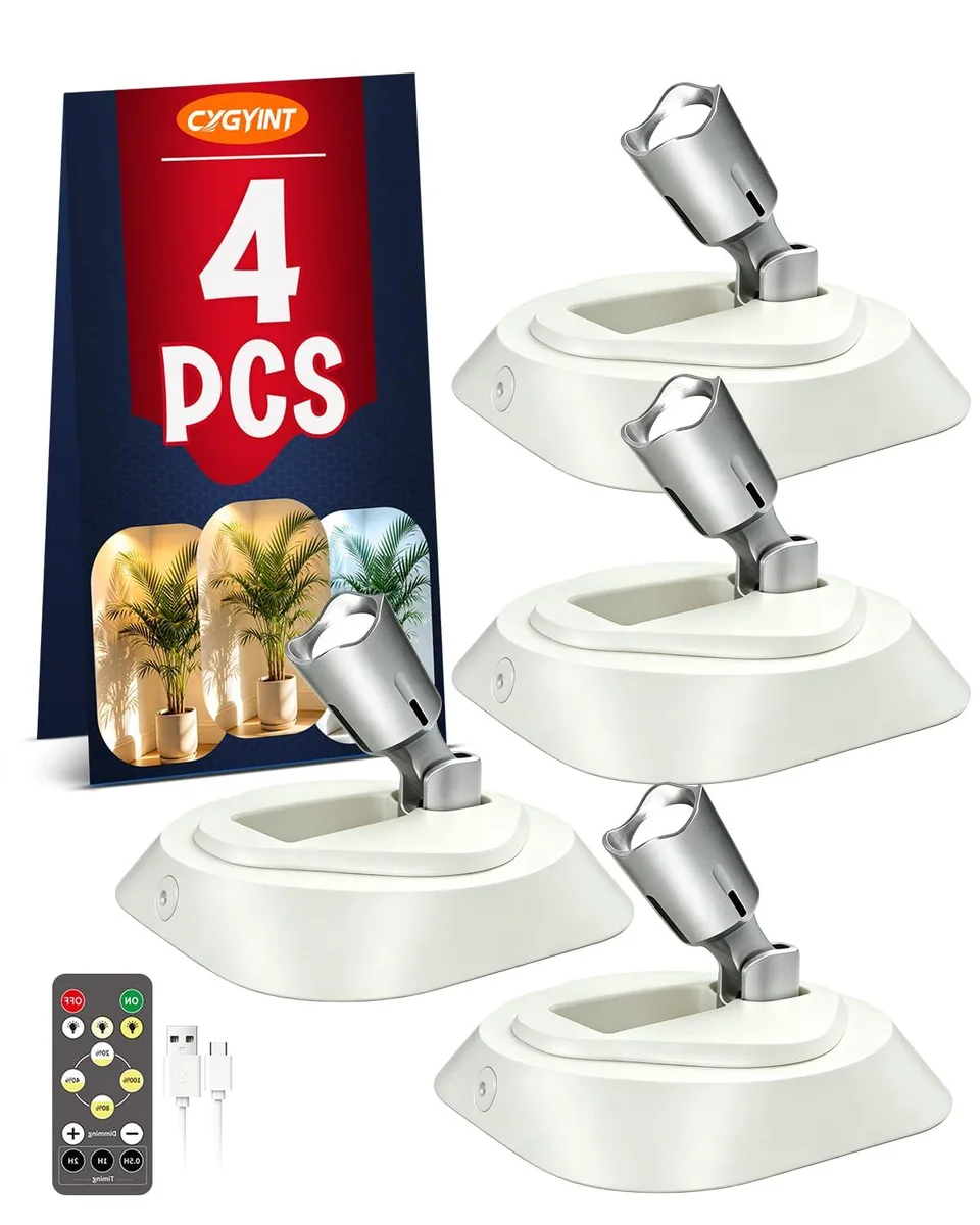 Four small white acrylic spotlights with adjustable heads and remote control