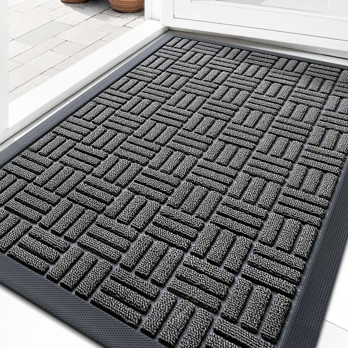 Grey rectangular door mat with maze pattern and natural rubber backing