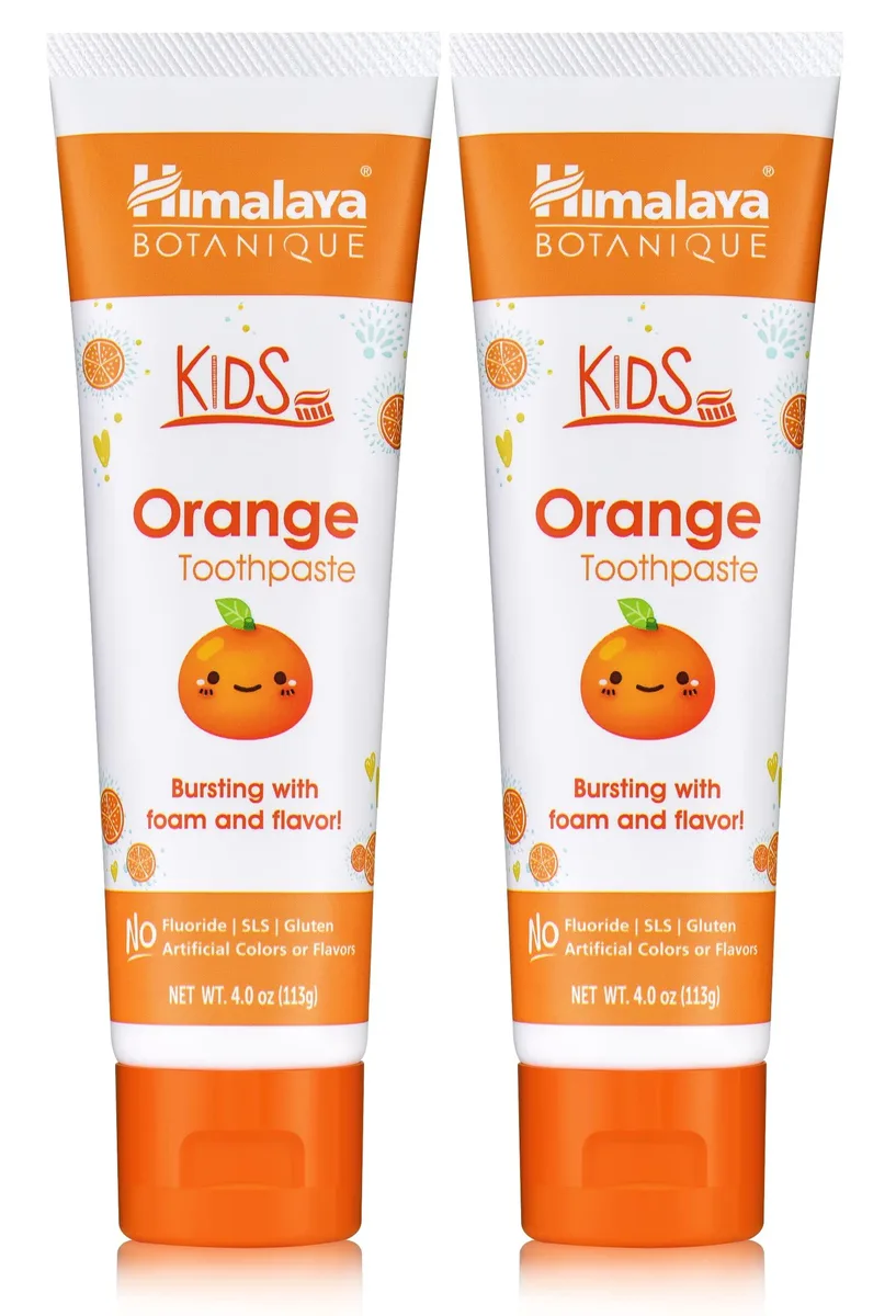Two orange toothpaste tubes in a cardboard box