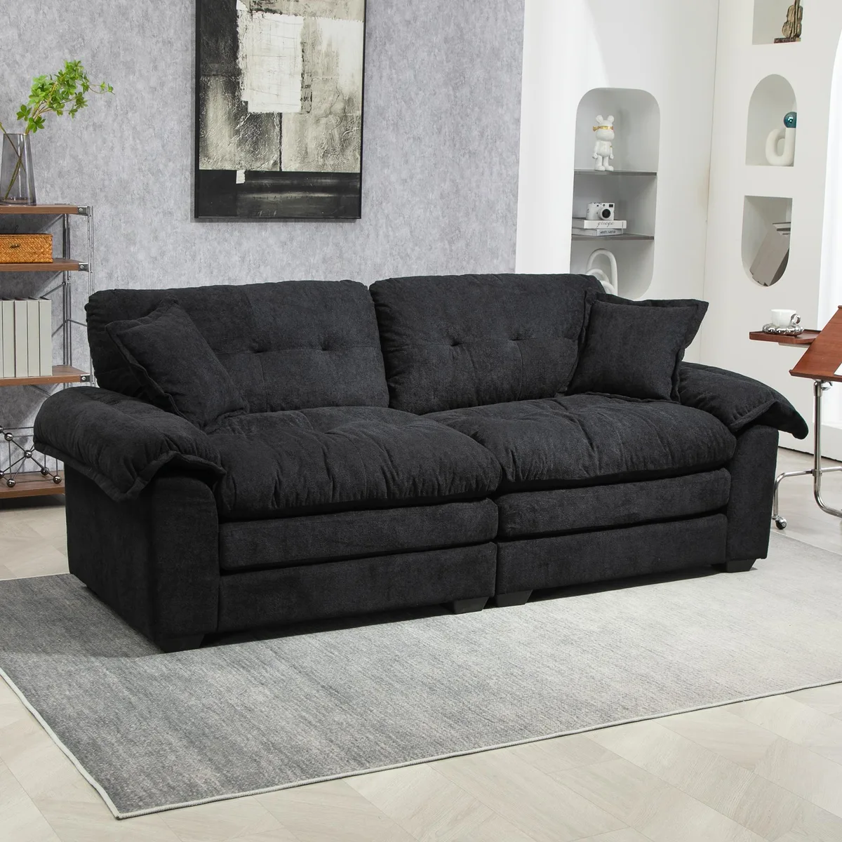 Black chenille loveseat with two throw pillows, low profile, wooden legs visible